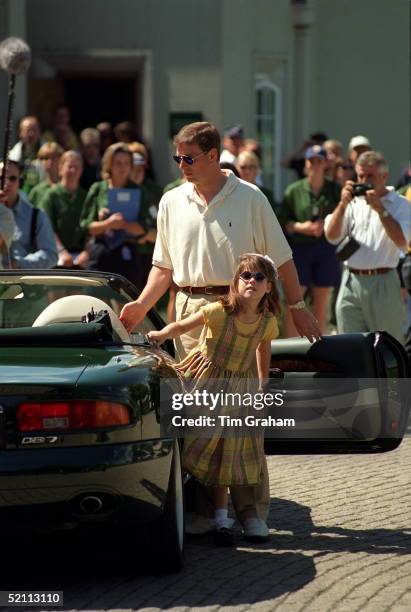 Prince Andrew With His Daughter, Princess Eugenie, Arriving In His Aston Martin Db7 Volante Convertible Car At Wentworth Golf Club For A Charity...