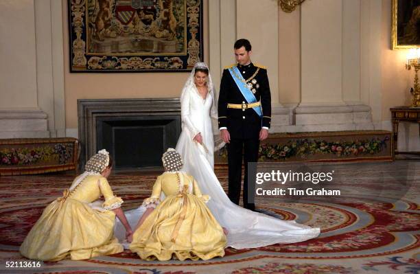 Crown Prince Felipe Of Spain, Prince Of The Asturias, With His Bride Crown Princess Letizia In The Royal Palace And Her Bridesmaids Attending To Her...