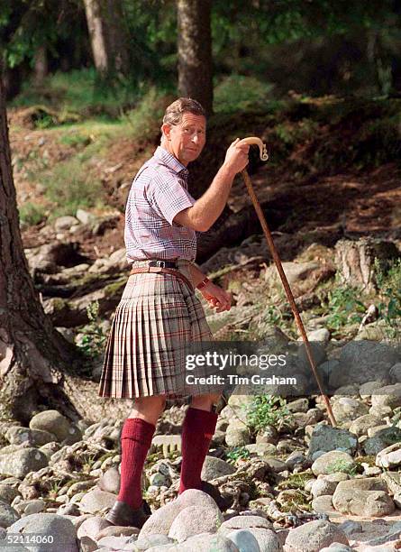 Prince Charles Wearing A Kilt And Carrying A Shepherd's Crook Walking Stick At Polvier, Balmoral Castle Estate. Wearing A Check Shirt Reported To Be...