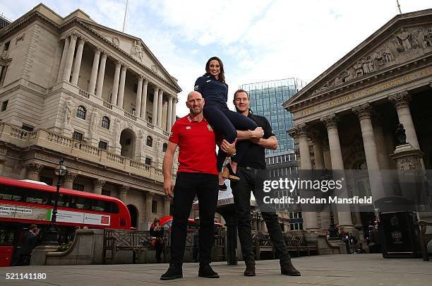 Former British & Irish Lion Lawrence Dallaglio and former New Zealand All Black Ali Williams lift soprano, Laura Wright during a media event to...