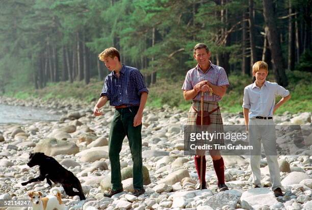 Prince Charles In Kilt And Sporran And Shepherd's Crook Walking Stick With Prince William & Prince Harry At Polvier, By The River Dee, Balmoral...