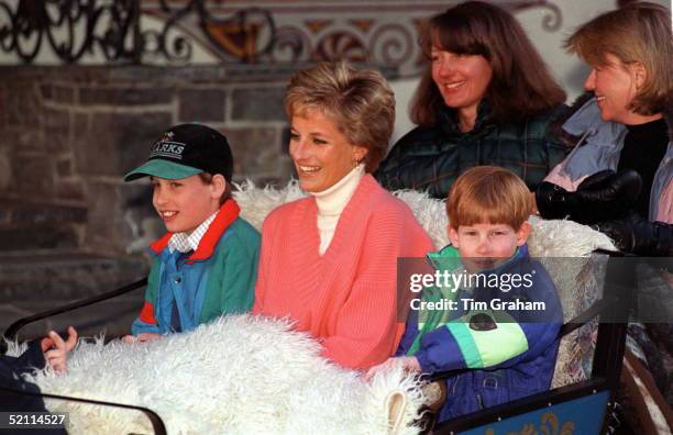 Princess Diana With Prince William & Prince Harry In Sleigh During Ski Holiday In Lech, Austria. Behind Are Diana's Friends Kate Menzies And...