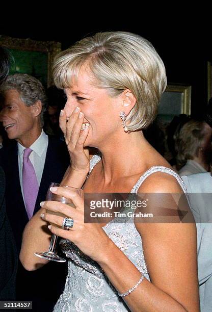 Diana, Princess Of Wales At The Christie's Pre-auction Party For The Launch Of The Auction Of Dresses. She Is Wearing A Dress By Fashion Designer...