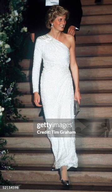 The Princess of Wales at a gala dinner at the National Gallery in Washington DC, 11th November 1985. She is wearing a white, crystal-beaded silk...