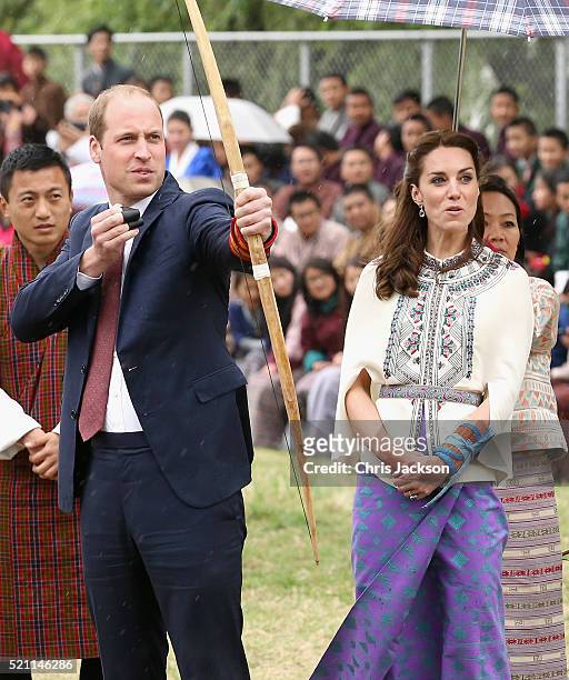 Prince William, Duke of Cambridge looks on as Catherine, Duchess of Cambridge fires an arrow during an Bhutanese archery demonstration on the first...