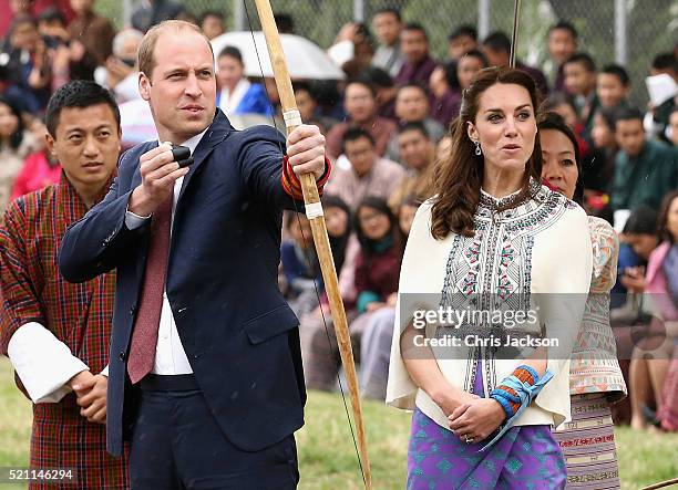 Prince William, Duke of Cambridge looks on as Catherine, Duchess of Cambridge fires an arrow during an Bhutanese archery demonstration on the first...