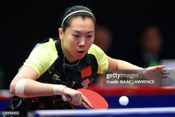 Li Xiaoxia of China returns the ball during the women's singles final match against Ishikawa Kasumi of Japan at the Asian Table Tennis Qualification...
