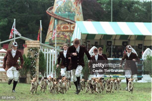 Boys From Eton School Compete At The Royal Windsor Horse Show Showing Off Their Pack Of Foxhounds.
