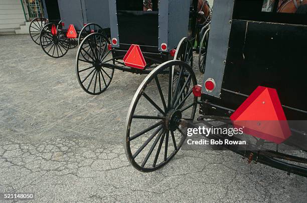 reflectors on the back of amish buggies - amish indiana stock pictures, royalty-free photos & images