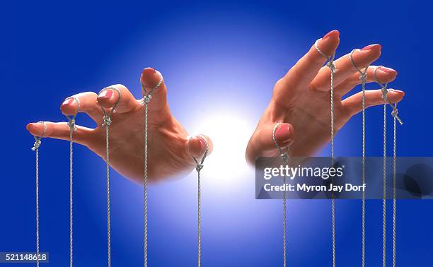 hands holding the strings - puppet stock pictures, royalty-free photos & images