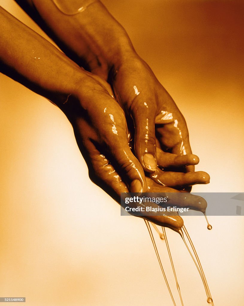 Oil in the hands of a woman