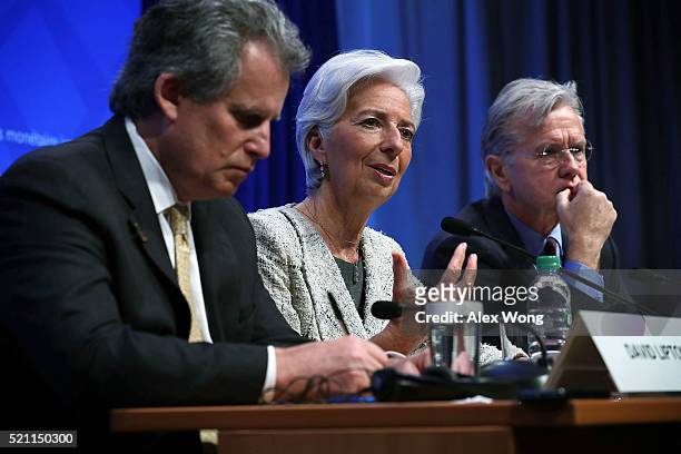 Managing Director Christine Lagarde speaks as First Deputy Managing Director David Lipton and Communictions Director Gerry Rice listen during a news...