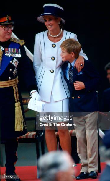 Diana, Princess Of Wales Hugging Prince Harry, As They Watch The Vj Day Parade In The Mall. She Is Wearing A Suit By Fashion Designer Tomasz...