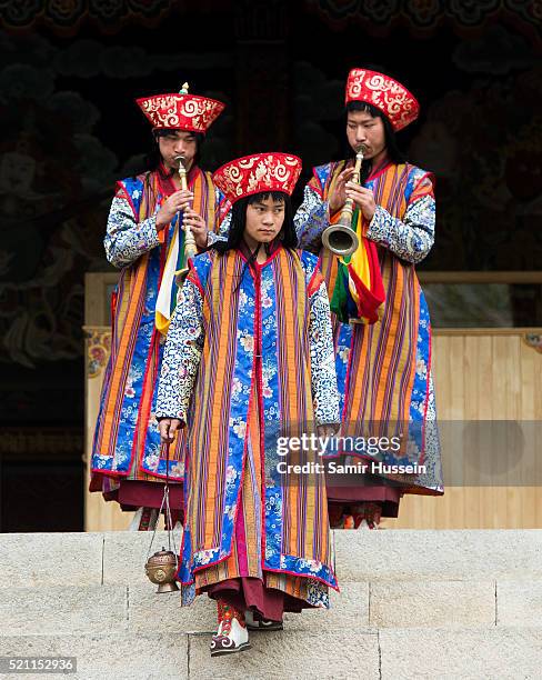 Musicians perform as Prince William, Duke of Cambridge and Catherine, Duchess of Cambridge attend a ceremonial welcome and audience at TashichhoDong...