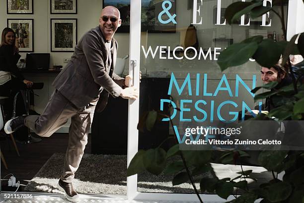 Designer Antonio Marras and elle.it director Luca Lanzoni pose at the Elle.it lounge during the Milan Design Week on April 14, 2016 in Milan, Italy.