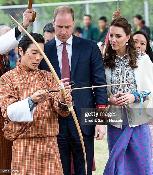 Catherine, Duchess of Cambridge and Prince William take part in archery at Thimphu's open-air archery venue on April 14, 2016 in Thimphu, Bhutan.