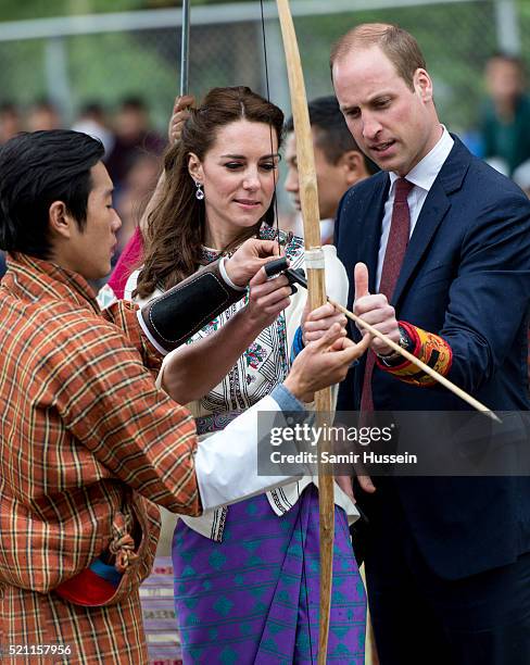 Catherine, Duchess of Cambridge and Prince William take part in archery at Thimphu's open-air archery venue on April 14, 2016 in Thimphu, Bhutan.