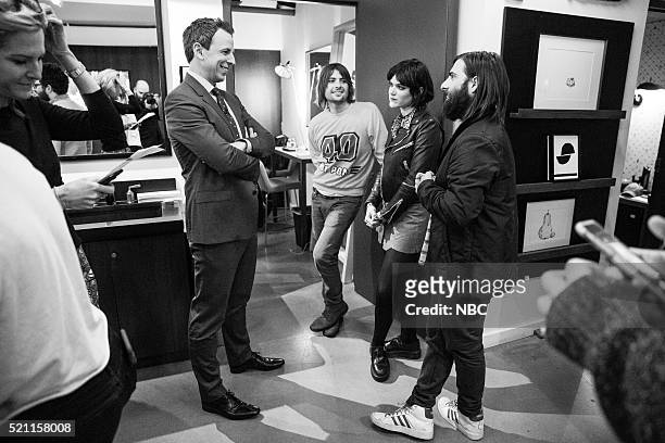 Episode 356 -- Pictured: Host Seth Meyers talks with Robert Schwartzman, Soko and Jason Schwartzman of musical guest Rooney backstage on April 13,...