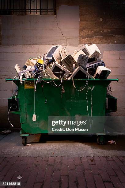 dumpster full of computer equipment - industrial garbage bin stock pictures, royalty-free photos & images