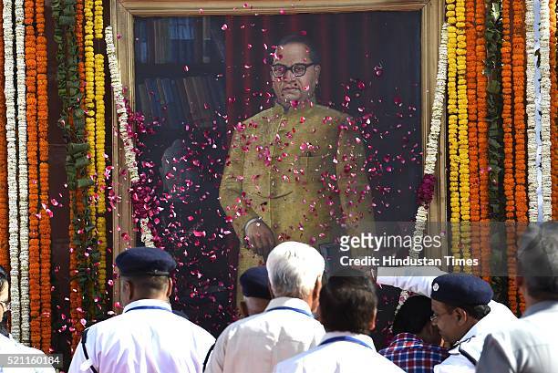 People pay tributes during the floral tribute ceremony of Dr. B.R. Ambedkar on his 125th birth anniversary at Parliament House, on April 14, 2016 in...