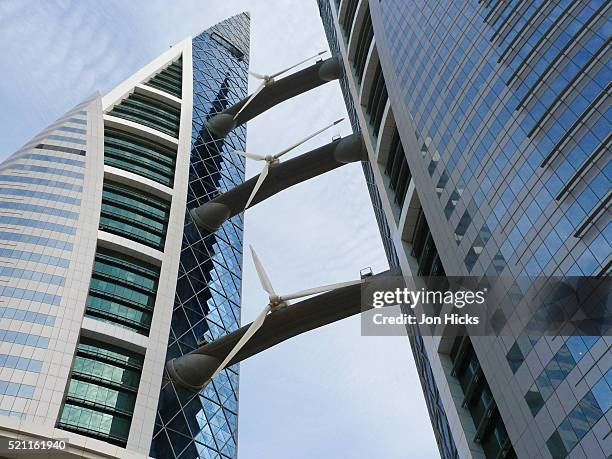 wind turbines at the bahrain world trade center - bahrain world trade center stock pictures, royalty-free photos & images