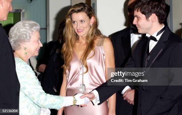 Queen Elizabeth Meeting Actor Daniel Bruhl Before The Royal Film Performance Of 'ladies In Lavender' At The Odeon Cinema In Leicester Square. He...