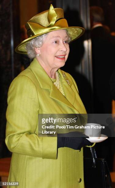 Queen Elizabeth II Drinking Tea During Her Visit To The Newly Refurbished Ministry Of Defence Building In Whitehall, London. The Queen Is Wearing A...