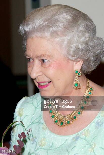 Queen Elizabeth II Wearing Jewelery Of Emeralds And Diamonds To Match A Green Evening Dress At The Royal Film Performance Of 'ladies In Lavender' At...