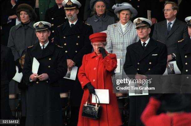 The Queen Wiping A Tear From Her Eye At The De-commissioning Ceremony For Hmy Britannia. With Her Are Prince Philip And Prince Charles And Behind Her...