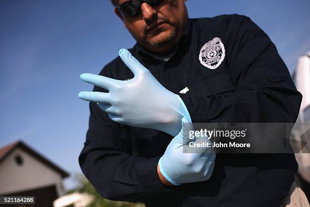 Environmental health specialist Aaron Salazar prepares to check a "mosquito trap" on April 14, 2016 in McAllen, Texas. City workers are catching...