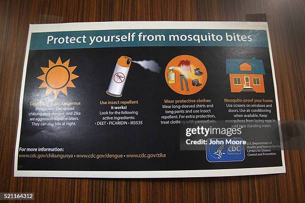 Centers for Disease Control , flier hangs taped to a door on April 14, 2016 in McAllen, Texas. Health departments, especially in areas along the...