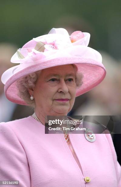 Queen Elizabeth Ll At Guards Polo Club Watching A Match To Raise Funds For The Prince's Trust Charity. She Is Wearing A Pearl Necklace And Earrings...