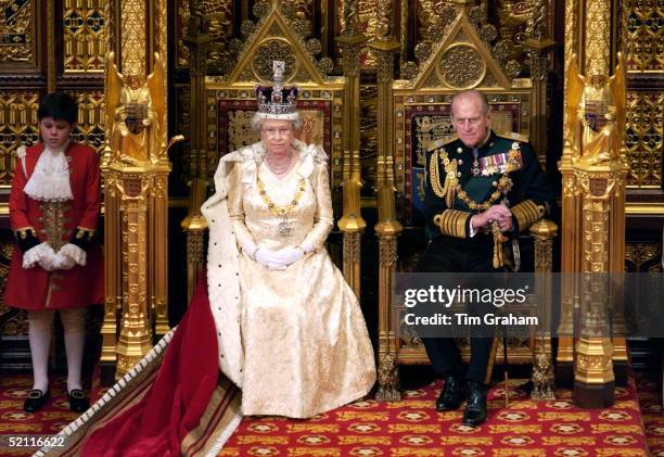 Queen Elizabeth Ll And Prince Philip At The State Opening Of Parliament Seated On Thrones In The House Of Lords In The Palace Of Westminster. The...