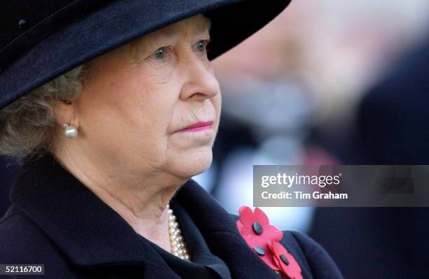 Queen Elizabeth II Wearing A Black Outfit For Mourning With Red Poppies And A Sad Expression Visiting The Field Of Remembrance At Westminster Abbey...