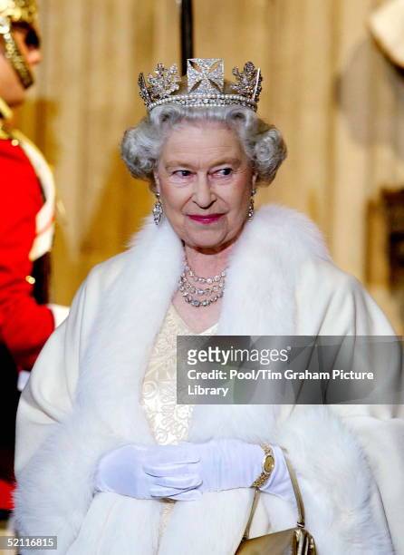 Queen Elizabeth II Smiling As She Arrives At The Palace Of Westminster For The State Opening Of Parliament. The Queen Is Wearing A Diamond Crown...