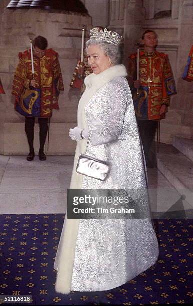The Queen At The Sovereign's Entrance Of The Houses Of Parliament Wearing A Fur-trimmed Full Length Silver Coat And A Tiara For The State Opening Of...