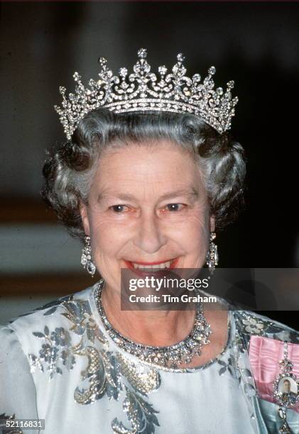 The Queen Smiling During A Royal Tour. She Is Wearing A White Crepe Evening Dress Embroidered With Silver By Designer Ian Thomas. The Queen Is...