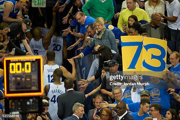 Rear view of Golden State Warriors players exiting court into tunnel through victorious fans after winning game vs Memphis Grizzlies at Oracle Arena....