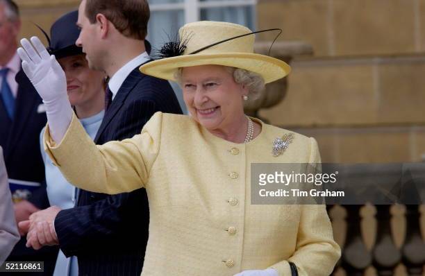 Queen Elizabeth II Happy And Waving At The Children's Party In The Garden Of Buckingham Palace To Mark The 50th Anniversary Of Her Coronation. Behind...