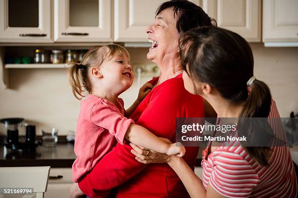 woman generations enjoying life - frau offenes lächeln küche stock-fotos und bilder