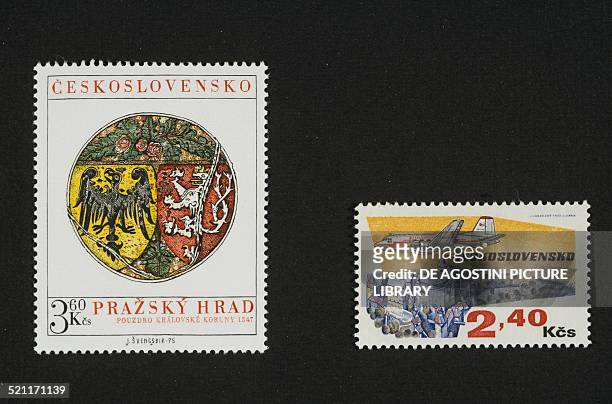 Postage stamp depicting a coat of arms from 1347 and on the right; postage stamp depicting an aircraft flying over a castle, 1973. Czechoslovakia,...