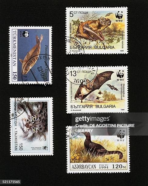 Postage stamps honouring the work of the WWF, top left, postage stamp depicting a Caspian seal Turkmenistan; bottom left, postage stamp depicting a...
