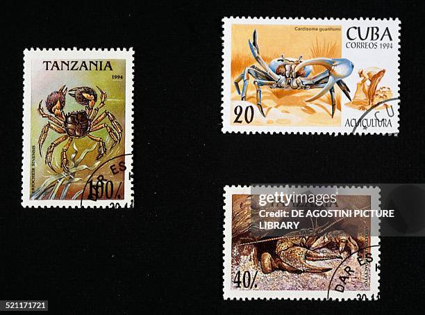 Postage stamps honouring shellfish: left and bottom right, postage stamps depicting a Chinese mitten crab and Danube crayfish Tanzania; top right,...