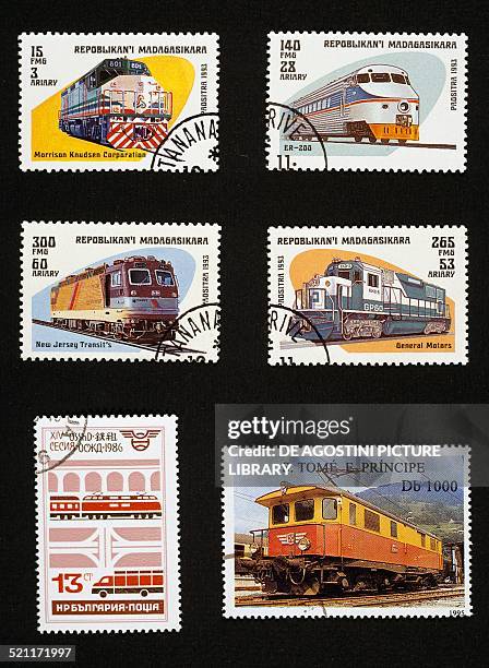 Postage stamps honouring electric locomotives: top and centre, postage stamps depicting the Morrison Knudsen Corporation, Er-200, New Jersey Transit...