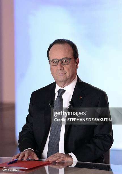 French President Francois Hollande is seen in a studio set-up by France 2, a public television station, at the Musee de L'homme as he readies to face...