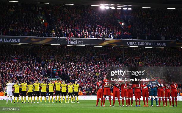 The team's stand for a minute's silence during the UEFA Europa League quarter final, second leg match between Liverpool and Borussia Dortmund at...