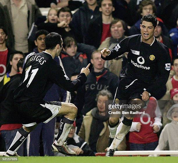 Cristiano Ronaldo of Manchester United is congratulated by Ryan Giggs after scoring their second goal of the game during the Barclays Premiership...