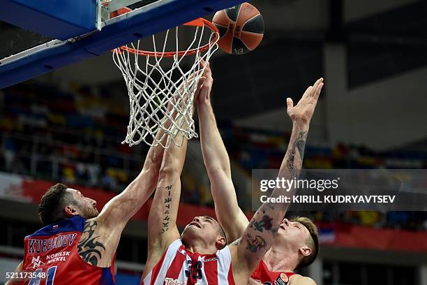 Moscow's forward Nikita Kurbanov and CSKA Moscow's forward Andrey Vorontsevich vie Crvena Zvezda's German center Maik Zirbes during the Euroleague...