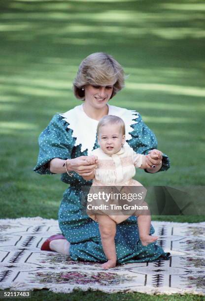 Princess Diana Helping Baby Prince William To Stand Up During A Photocall At The Start Of The Royal Tour Of New Zealand.