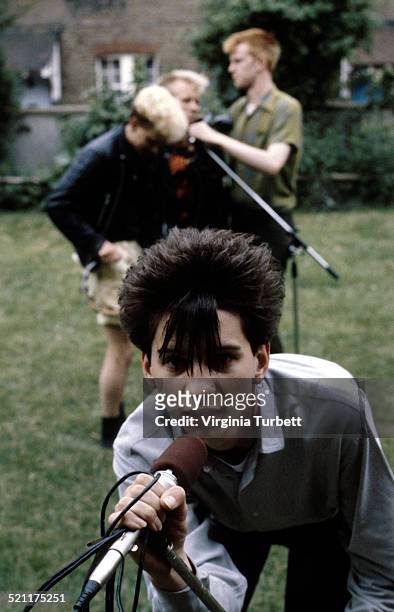 Depeche Mode pose with microphones, circa 1981. Dave Gahan is at the front, behind are Martin Gore, Vince Clark, Andrew Fletcher.